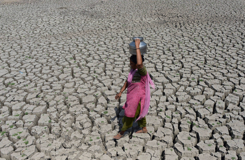 Indian woman walking on the dry land